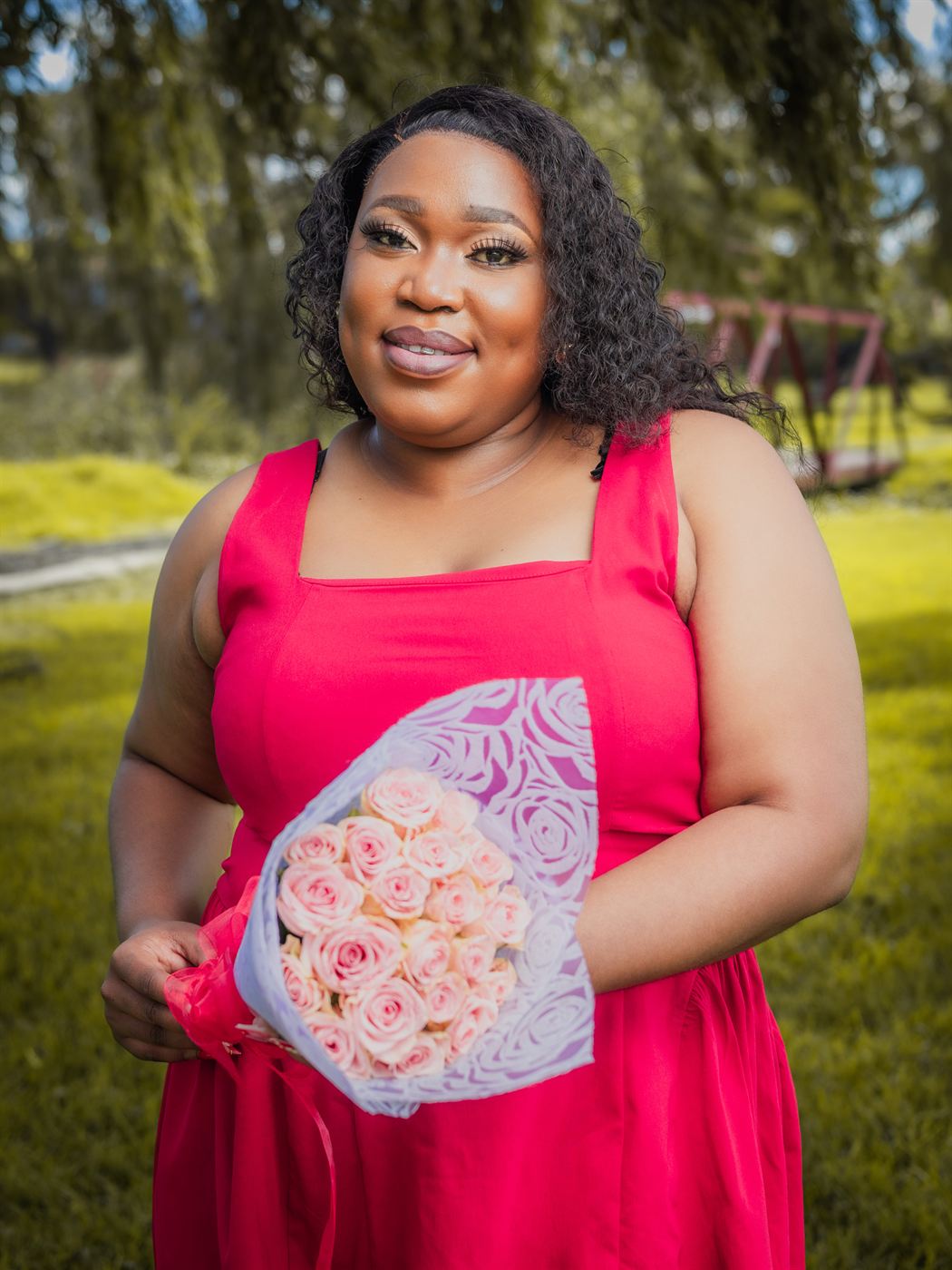 Portrait with rose bouquet golden light